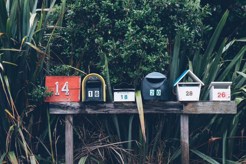 Mailboxes sitting on top of a board